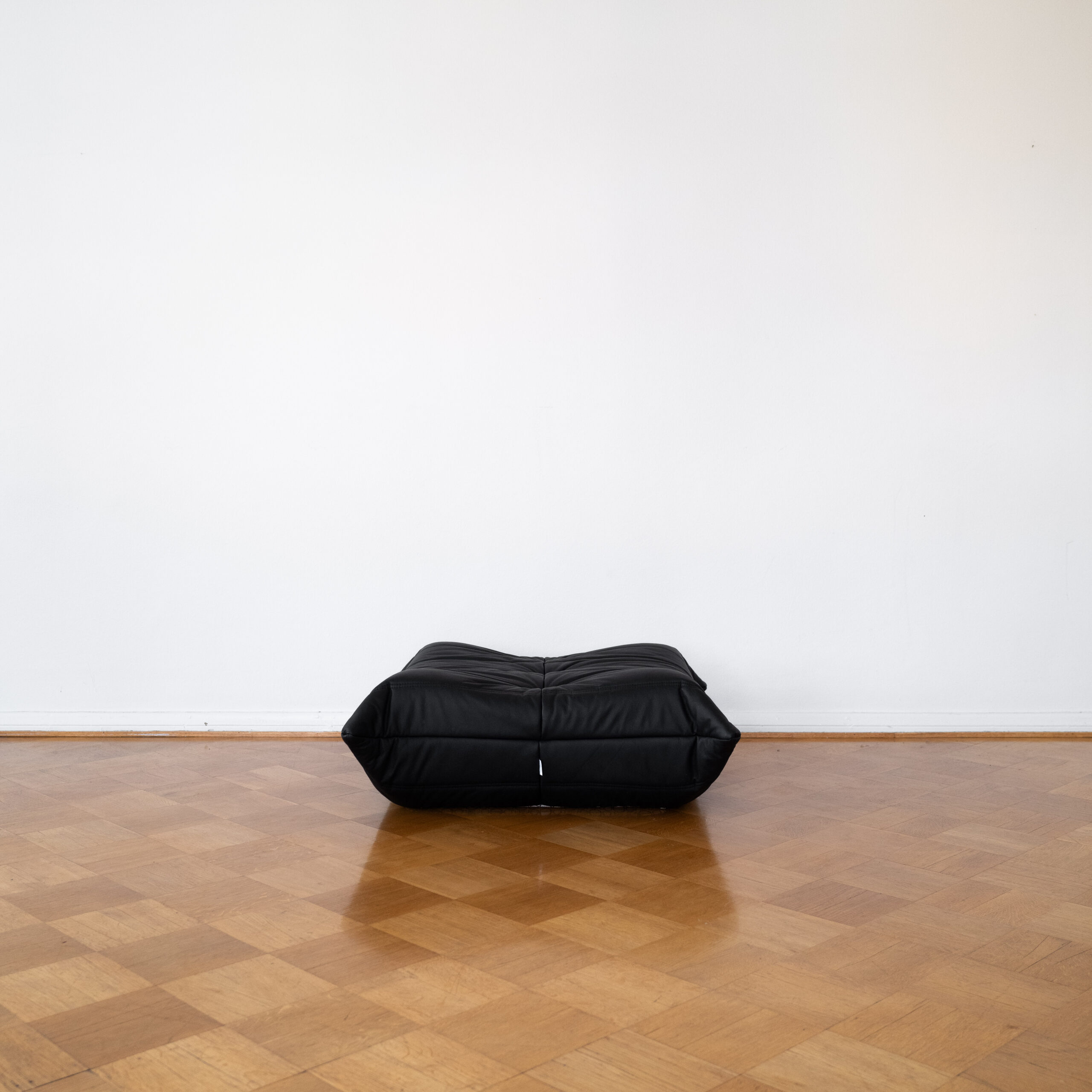 Black Leather Togo Ottoman by Michel Ducaroy for Ligne Roset